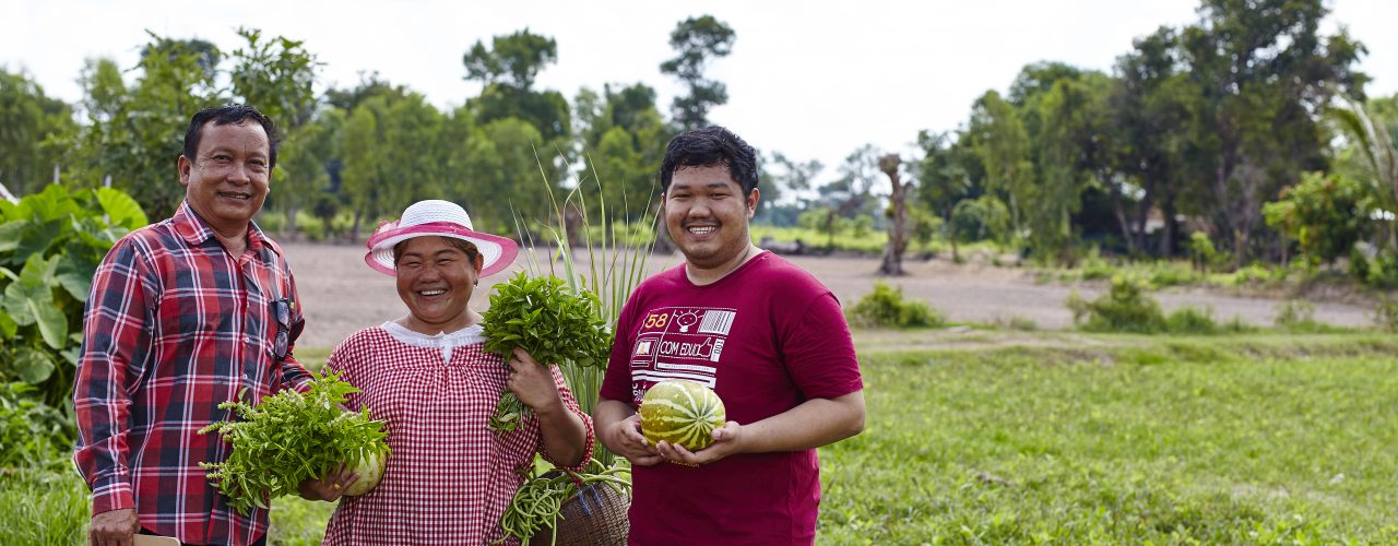 Khun Orapin with her husband and son at the fields in Thailand